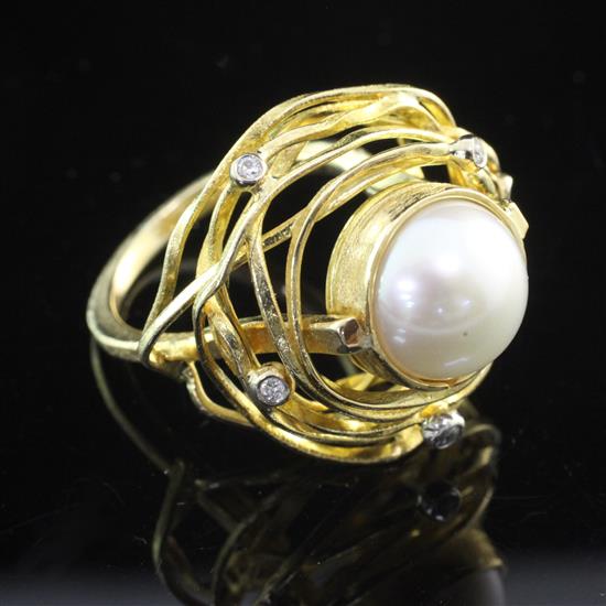 An 18ct gold, mabe pearl and diamond set free form dress ring, size Q.